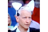 Anderson Cooper wearing a pair of robotic cat ears