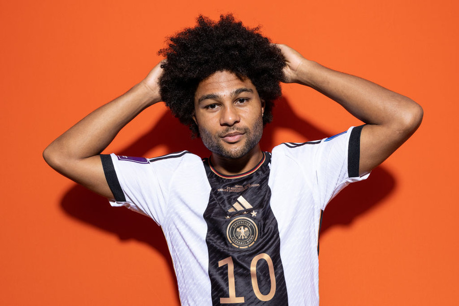 Germany Portraits - FIFA World Cup Qatar 2022DOHA, QATAR - NOVEMBER 17: Serge Gnabry of Germany poses during the official FIFA World Cup Qatar 2022 portrait session on November 17, 2022 in Doha, Qatar. (Photo by Buda Mendes - FIFA/FIFA via Getty Images)