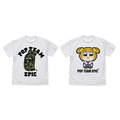 「ピピ美カモフラ柄 Tシャツ」2,900円+税 (C)大川ぶくぶ／竹書房　＆　「ベイビーポプ子 フルカラーTシャツ」4,000円+税 (C)大川ぶくぶ／竹書房