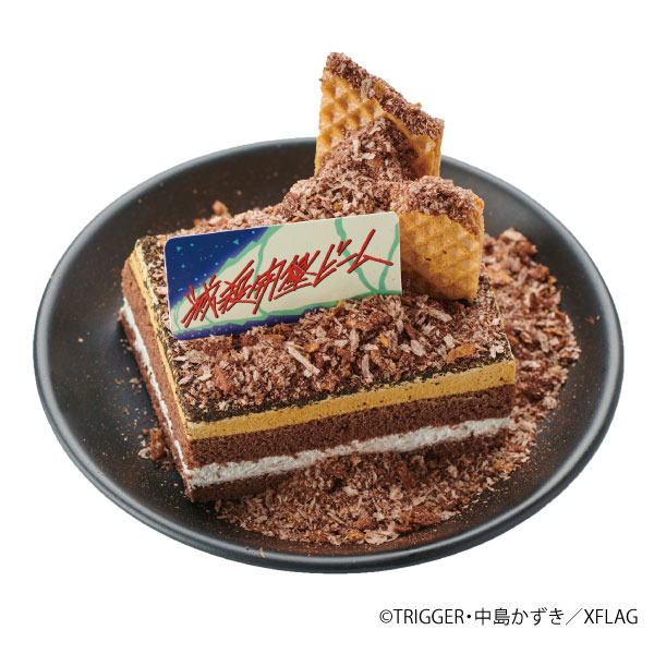 「映画『プロメア』ロングラン大感謝イベント」XFLAG STORE で放つ！滅殺開墾ビームケーキ 1,280 円（税抜）（C）TRIGGER・中島かずき／XFLAG