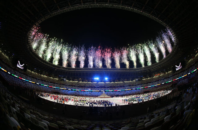 Tokyo 2020 Olympic Games opening ceremonyTOKYO, JAPAN - JULY 23: Artists perform as fireworks explode above the stadium during the opening ceremony of the Tokyo 2020 Olympic Games at the Olympic Stadium in Tokyo, Japan on July 23, 2021. (Photo by Ali Atmaca/Anadolu Agency via Getty Images)